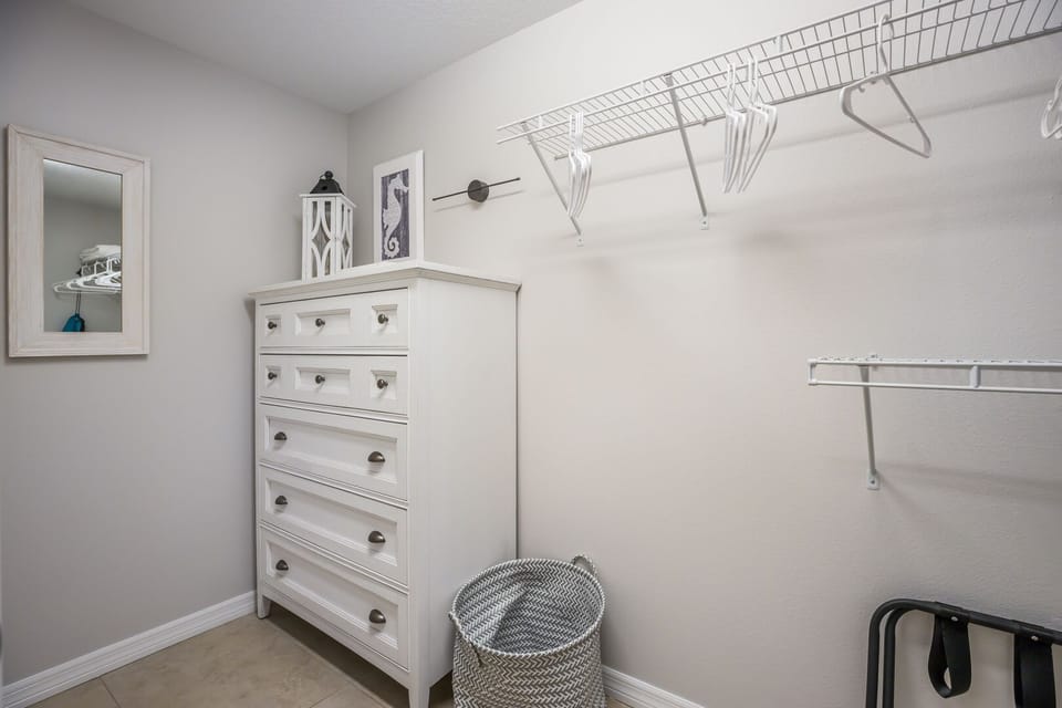 Walk-in closet for master bedroom at Toes in the Water
