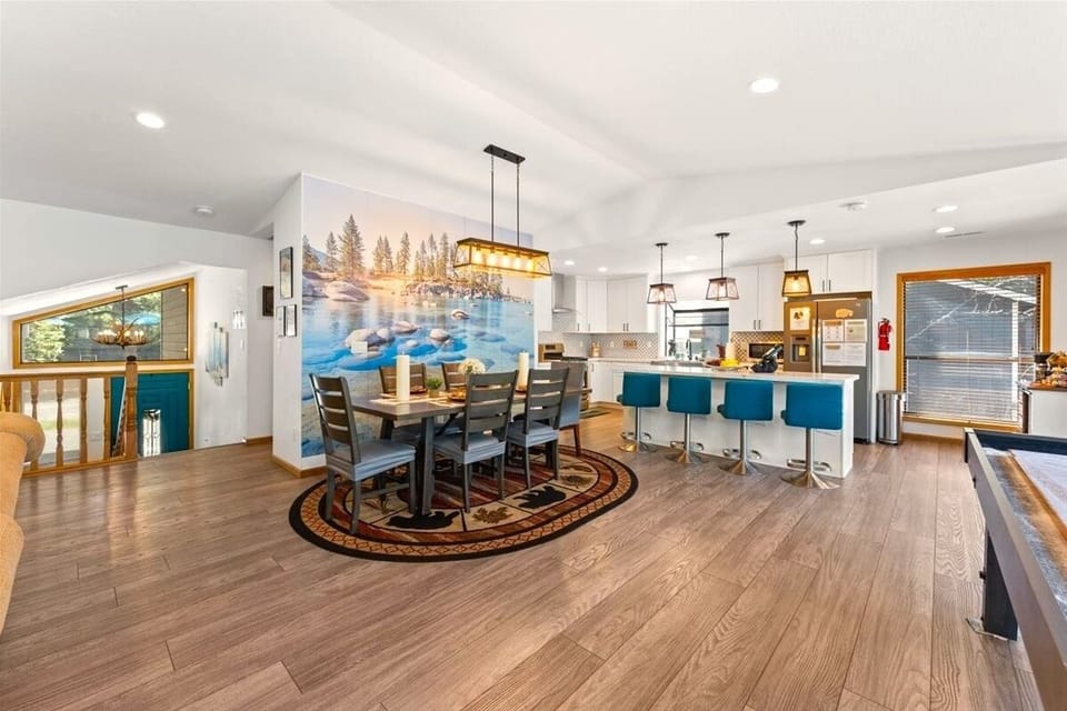 The open-concept layout keeps everyone connected — perfect for family meals, game nights, and relaxing cabin mornings together.