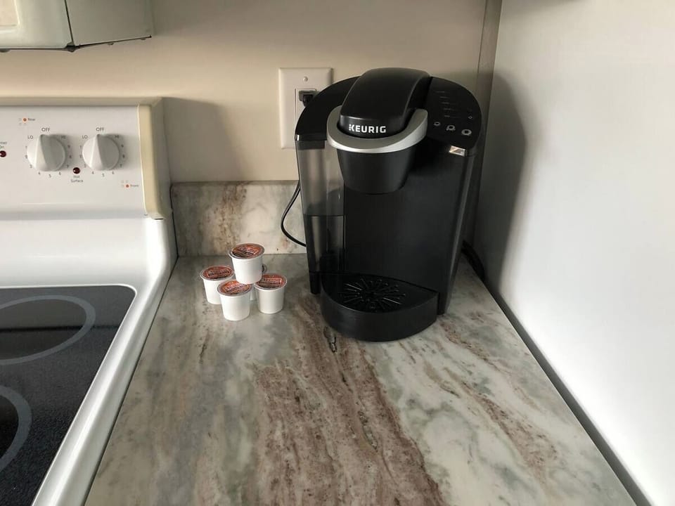 Keurig coffee maker supplied along with blender, pots & pans, as if as home.