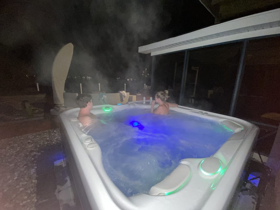 watch the sunset over the river in the hot tub