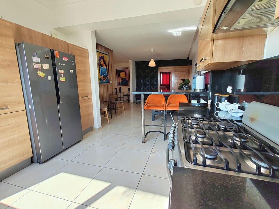 Open concept fully equipped kitchen on 1st lvl and next to indoor dining area.