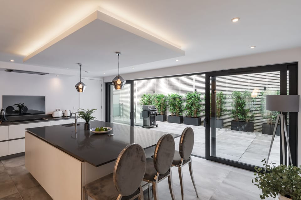 Kitchen with Island & sliding doors to patio
