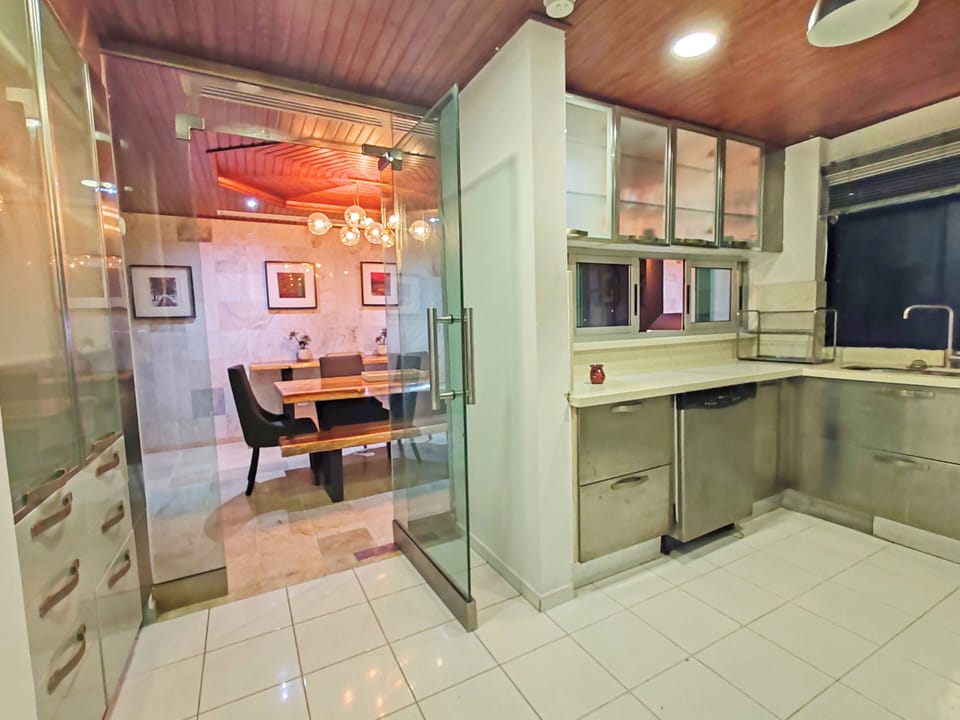 Fully equipped kitchen next to dining area.