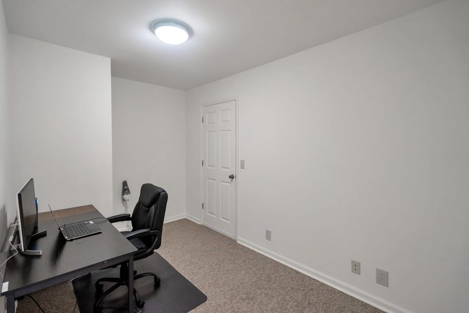 4th Room is office with desk, chair, chair mat and monitor.  High Speed Wifi