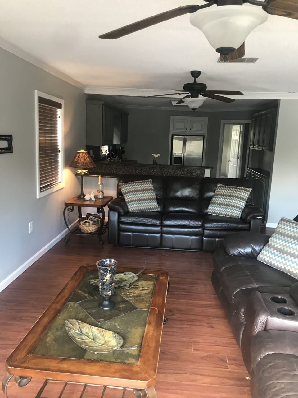 Different view of living room and kitchen.
