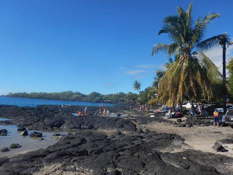 Discover dramatic lava-rock cliffs beside brilliant turquoise water.