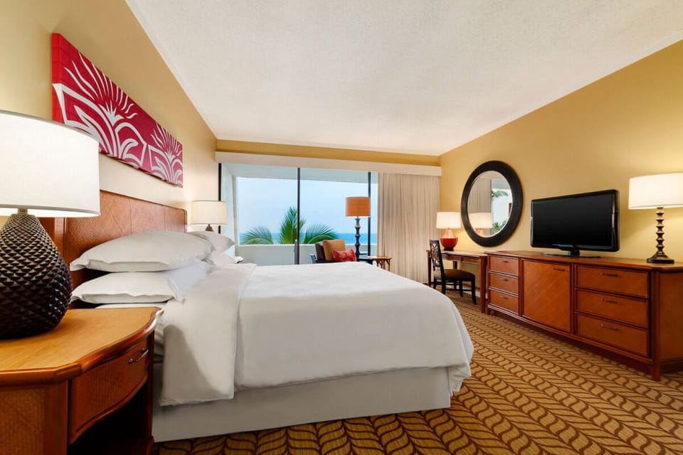 Wake up to ocean breezes in a bright king retreat.