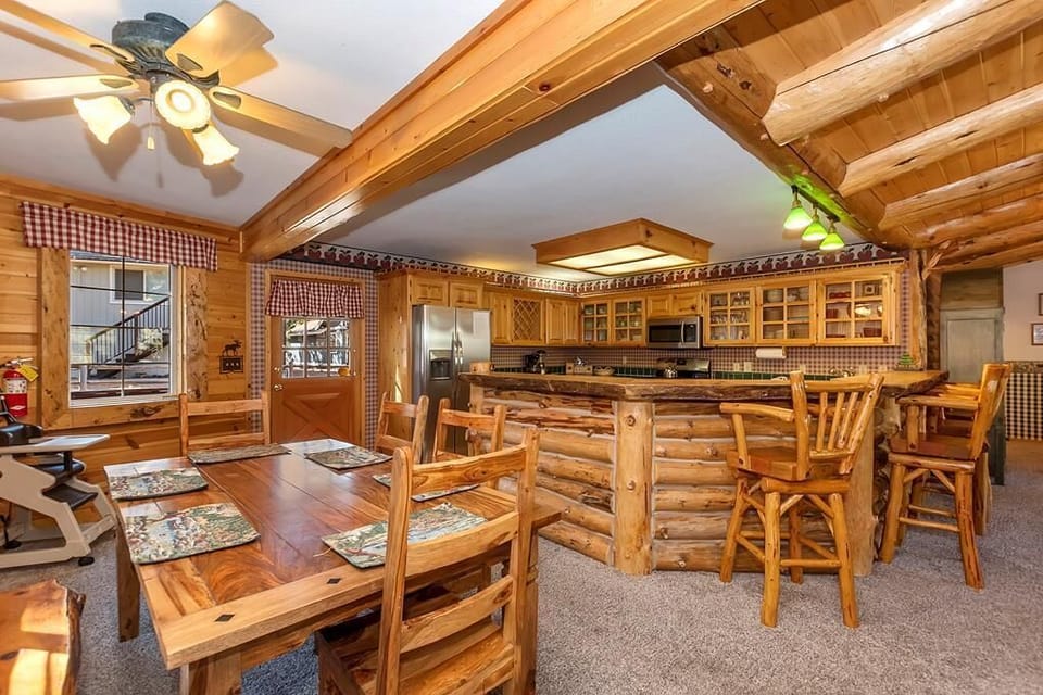 Dining Area & Kitchen With Bar Seating