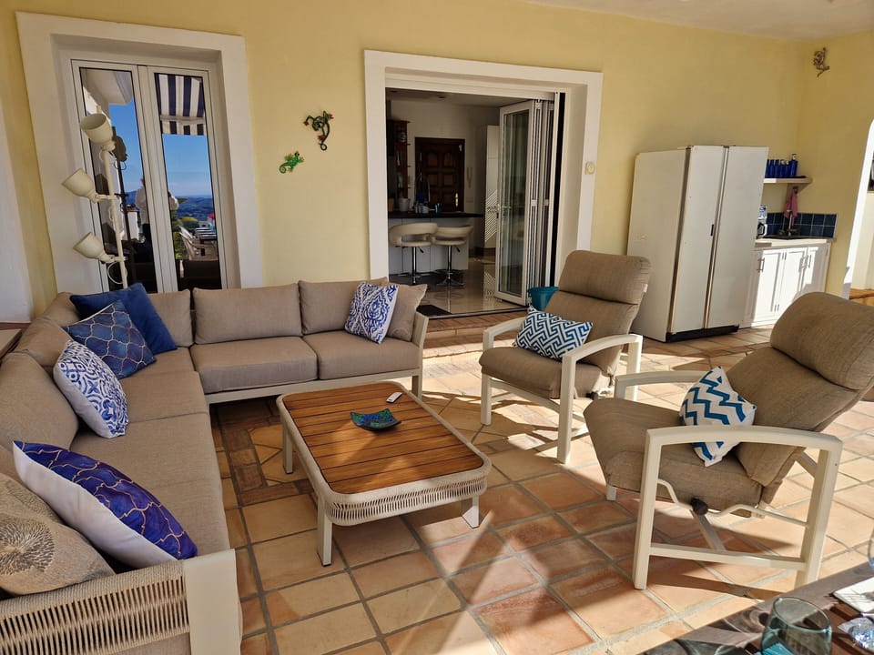 Welcoming sitting area with remote controlled awning.  