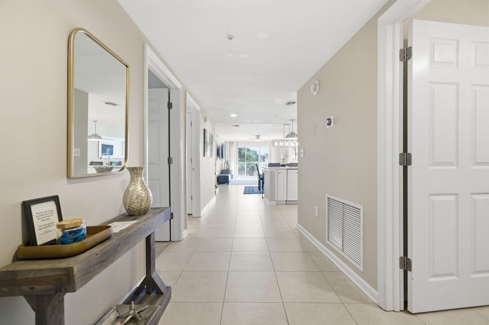 Bright and welcoming entry hallway leading you straight into the heart of your coastal getaway.