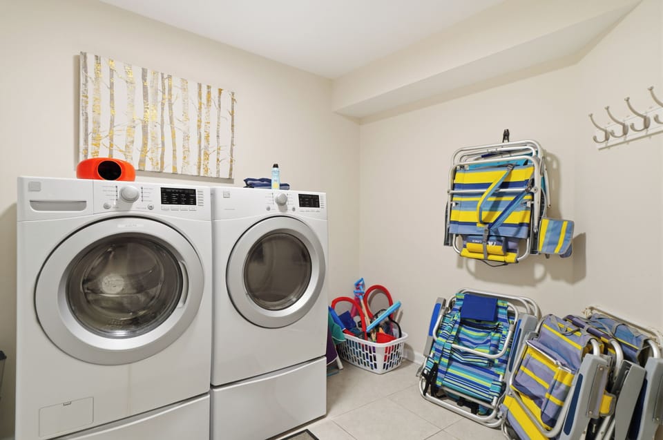 The laundry room has two full-size washer and dryers.
We also provide a take-a-piece leave a piece chairs and other beach essentials.