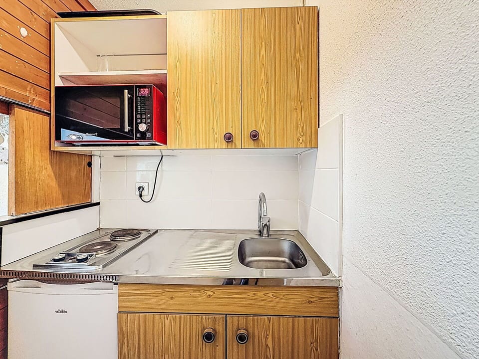 Wood, Interior Design, Flooring, Floor, Furniture, Room, Cabinetry, Kitchen, Major Appliance, Countertop
