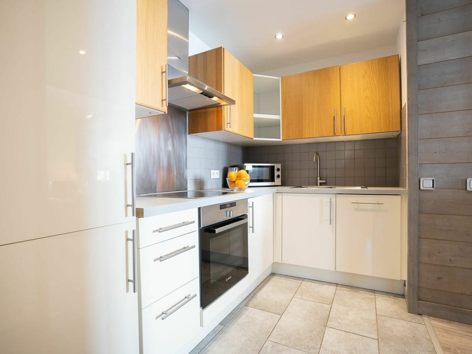 Countertop, Cabinetry, Furniture, Kitchen Appliance, Home Appliance, Building, Kitchen Stove, Kitchen, Wood, Interior Design