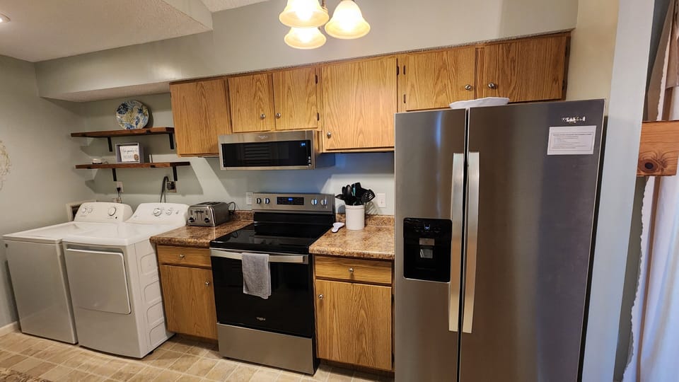 Washer and dryer, with plenty of space for cooking.
