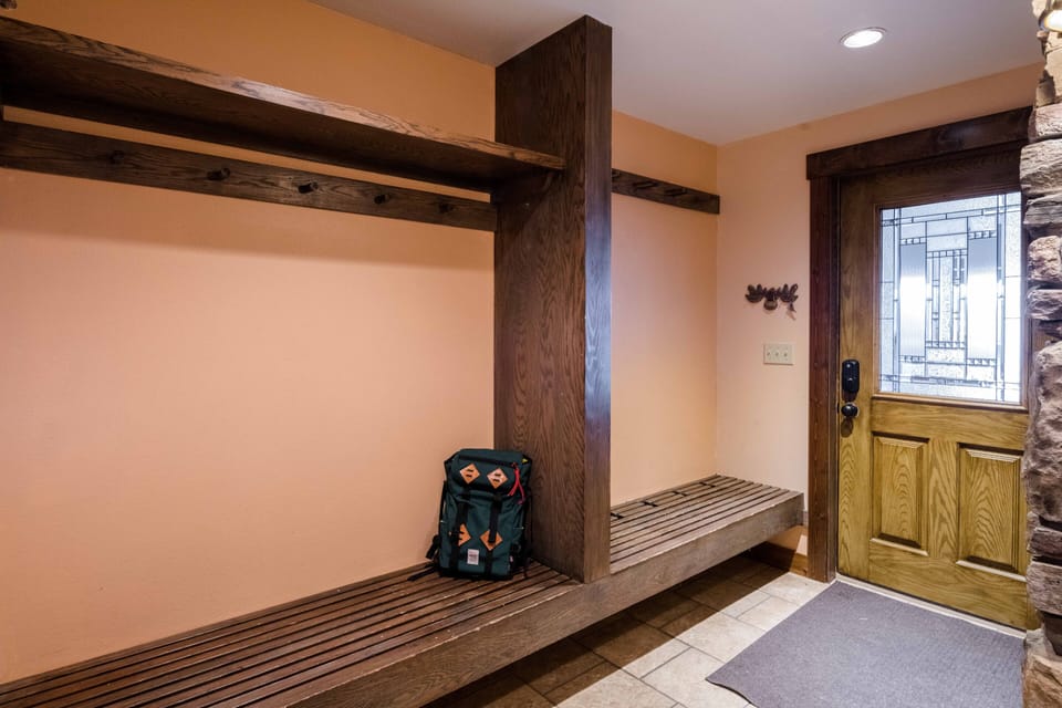Entrance to home with hooks for ski gear