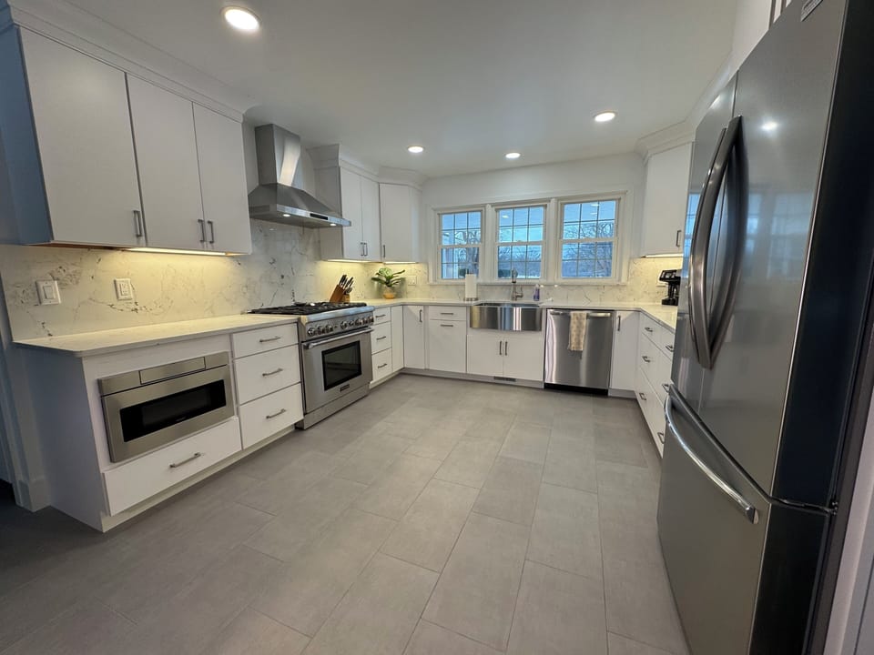 Brand new kitchen features a Thermador commercial range, and drawer microwave.