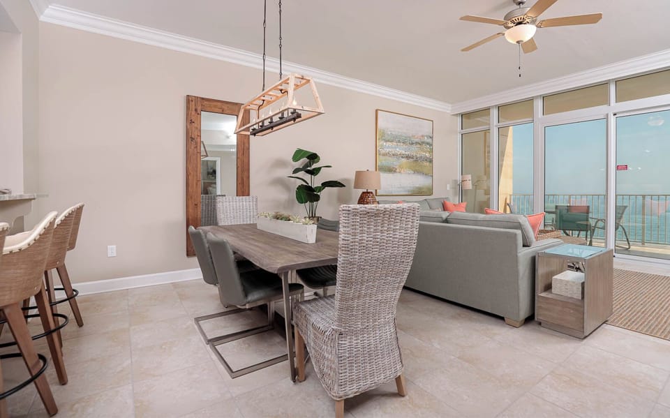 Gather around the modern dining table, enjoying laughter and memories with loved ones in this inviting space
