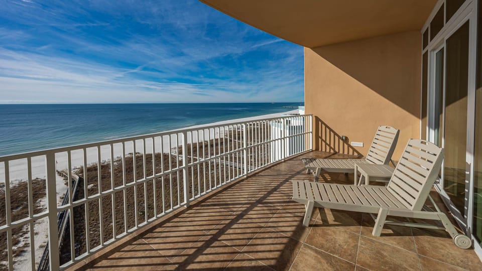Relax on the balcony, soaking in the serene beachfront views and the refreshing coastal breeze