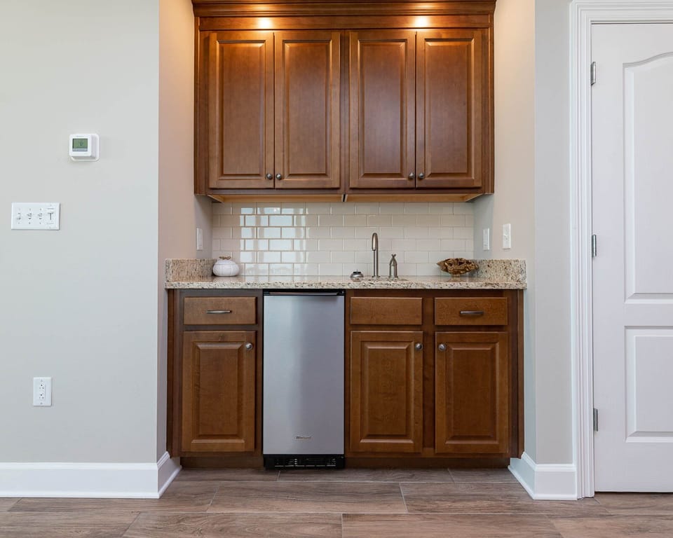 Mix refreshing drinks at the sleek wet bar, perfect for enjoying during your beach getaway