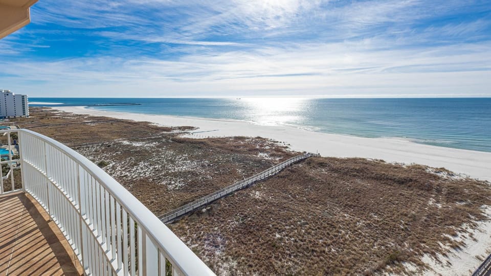 Relax on your balcony and bask in the sunlight with mesmerizing views of the gulf coast on your beach retreat
