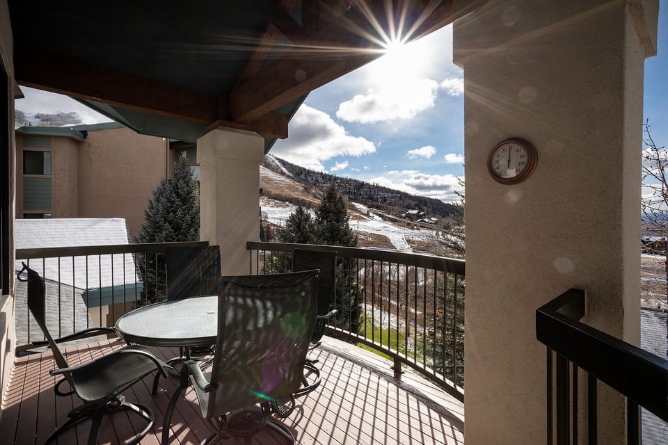 Sip your morning coffee on this sunny balcony while gazing at spectacular mountain views and snow-dusted slopes.