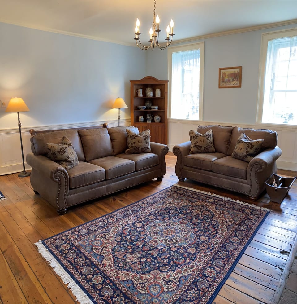 Living room/library with original hardwood floors