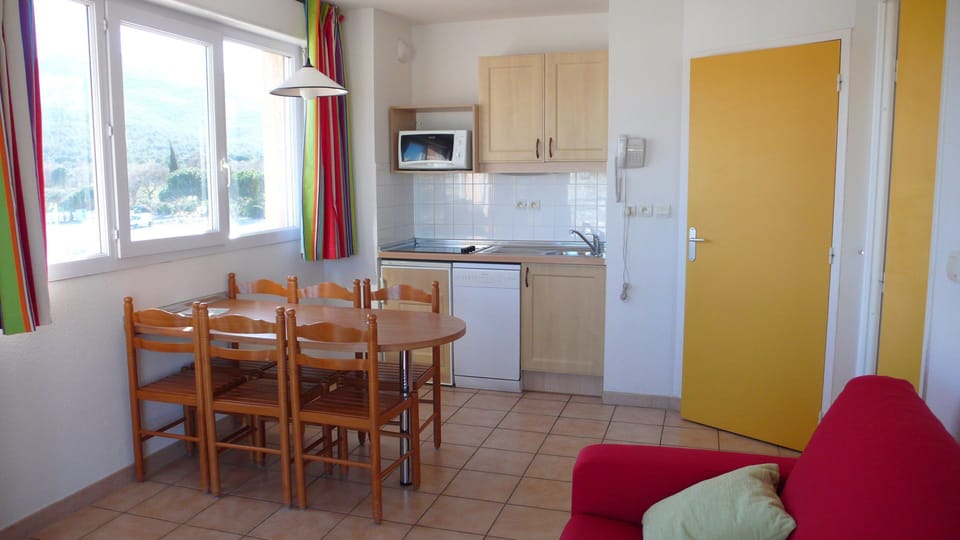 Loads of room at the dining table and the open concept is always nice for the cook.