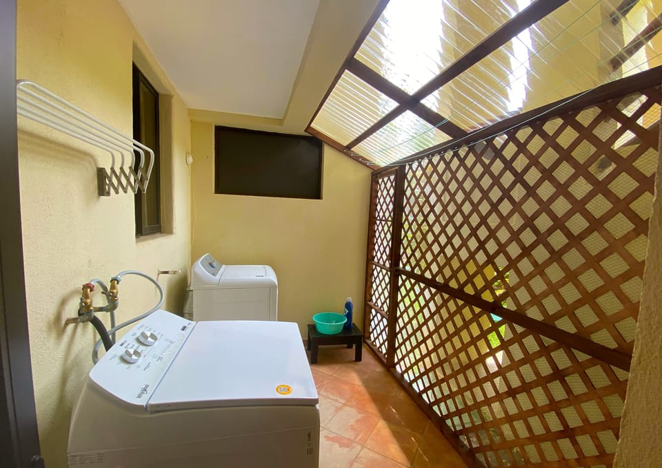 Laundry area with the backdoor entrance (covered and with a mosquito net)