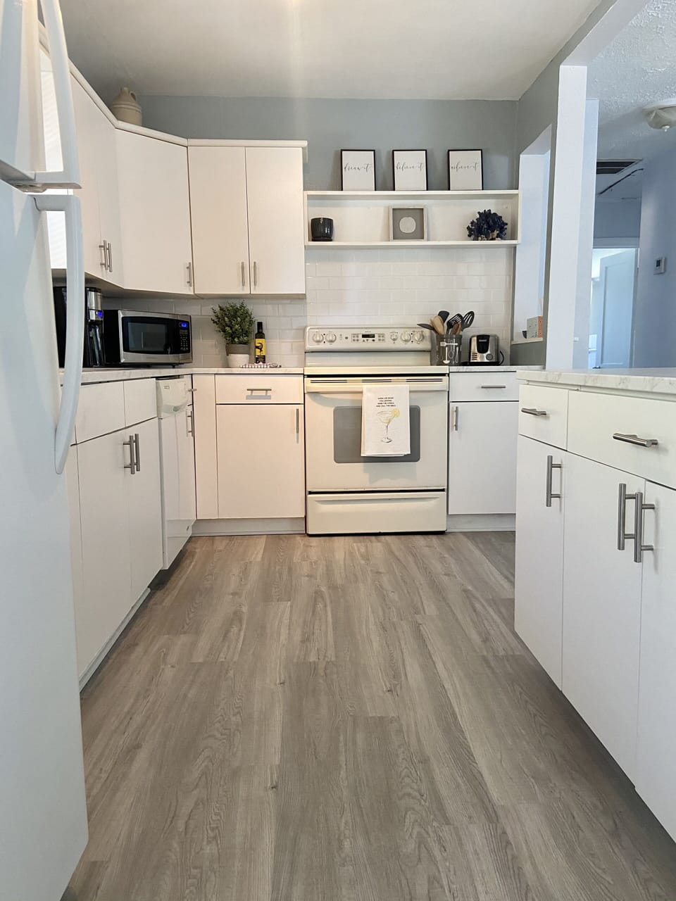 Fully stocked, spacious kitchen with breakfast bar and new appliances in 2023.