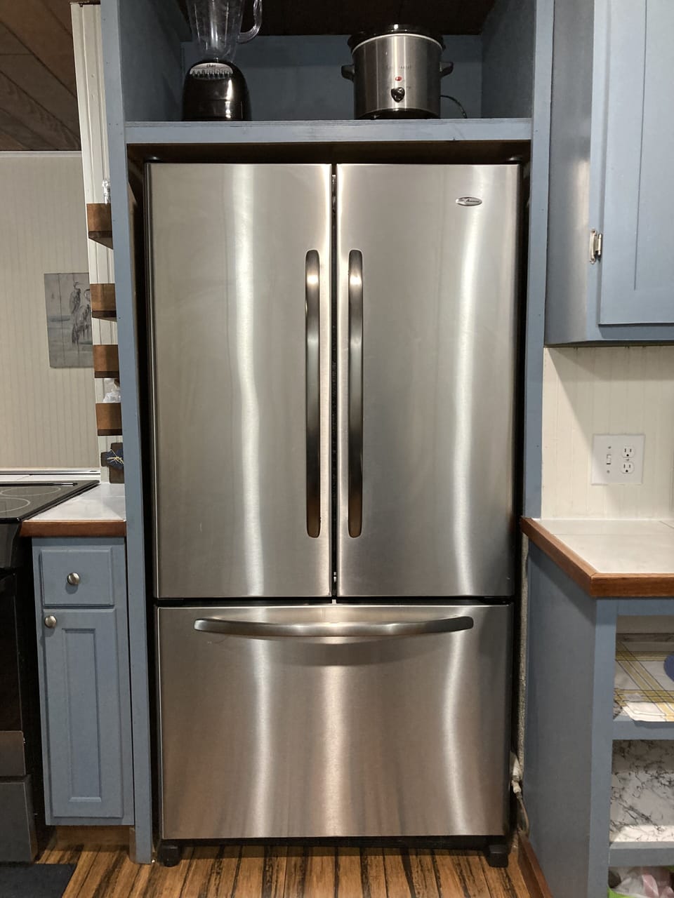 Full-sized refrigerator and freezer. 