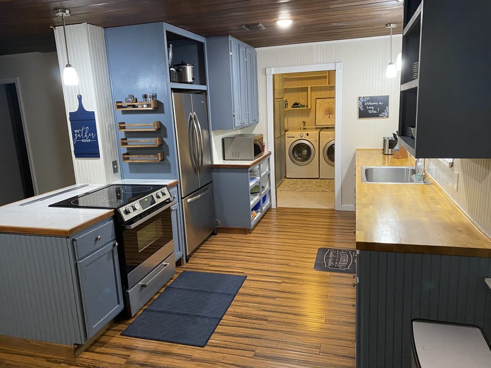 Kitchen has electric stovetop, oven, microwave, dishwasher, and refrig/freezer.