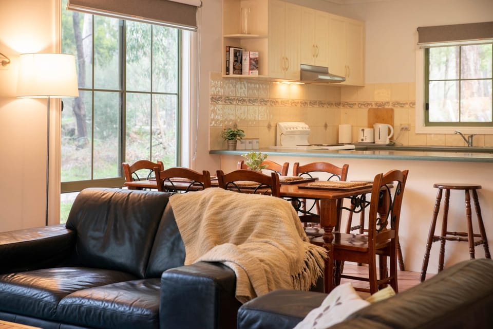 Cozy cottage feel with comfortable couches for relaxation.