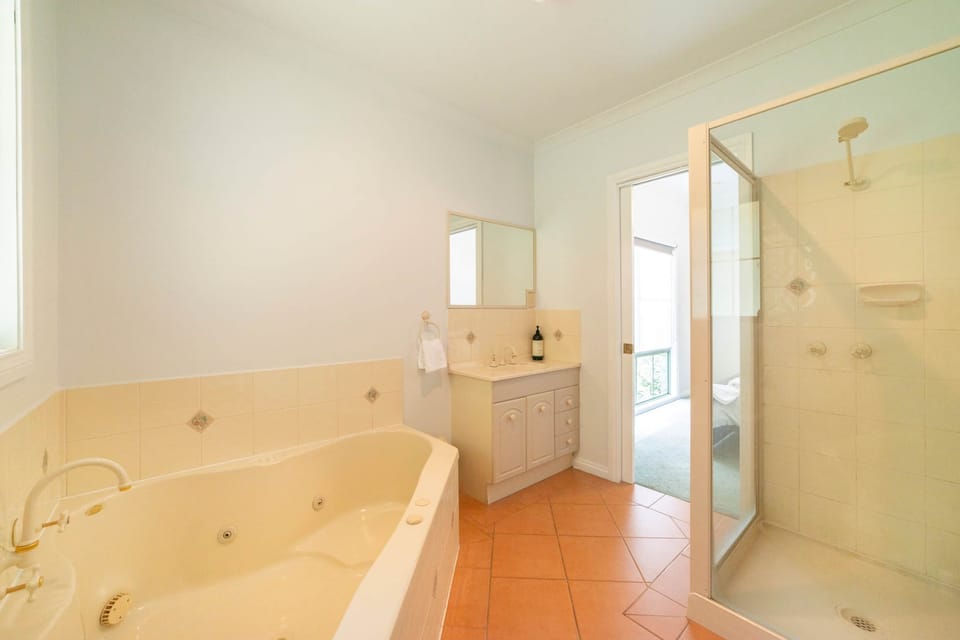 Main bathroom with spa bath for luxurious relaxation.