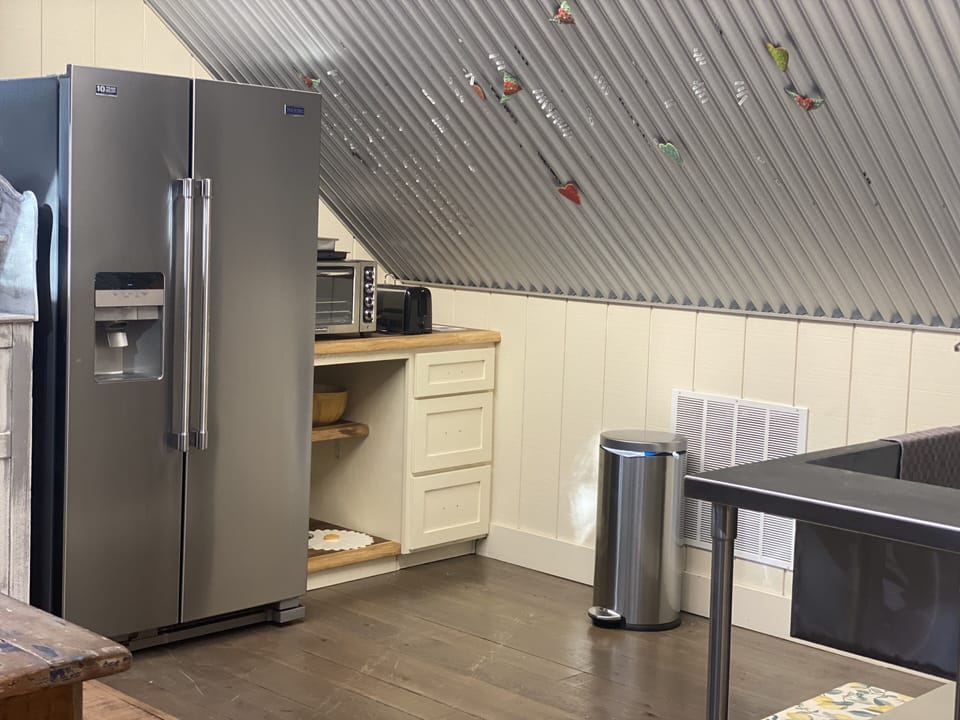 Our kitchen has a refrigerator, microwave, toaster, toaster oven but no stove. 