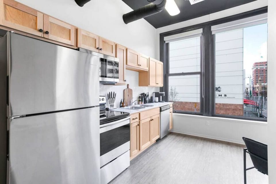 Sleek, fully stocked kitchen with high-end appliances—perfect for home-cooked meals or morning coffee.