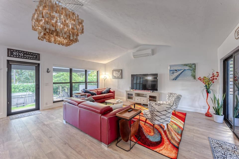 Open Layout Family Room overlooking expansive back yard and front patio.  65" Smart TV,  2 Full Size Sofa Sleepers. 