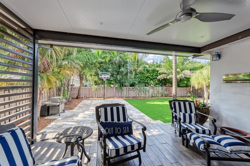 Expansive back yard with artificial turf, BBQ, Basketball Hoop, Cornhole & Plenty of Seating/Lounging space. 