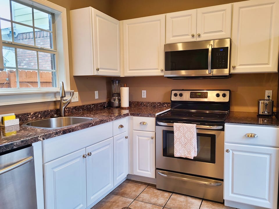 Fully stocked kitchen with large sink