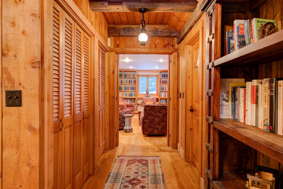 Hallway connecting the living room and the library/TV room