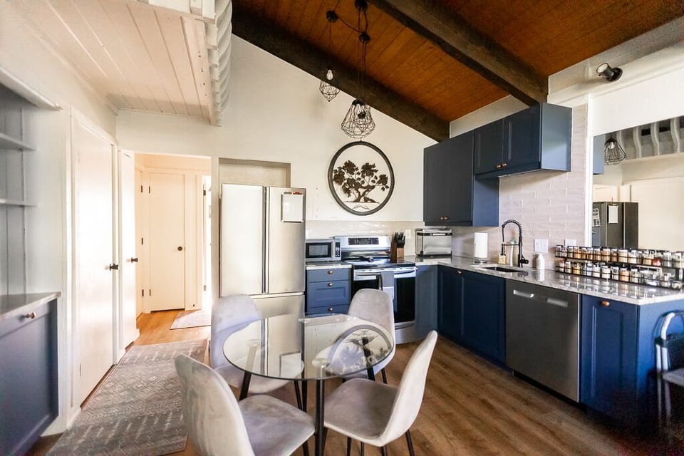 Well appointed kitchen with coffee options, spices, and cooking supplies.