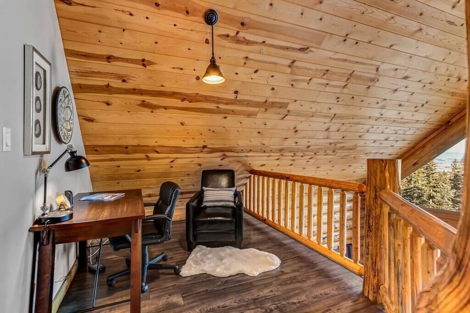 Work with a View - 
A loft desk ensures you can take care of work if needed — though the mountain views may make concentration a challenge.