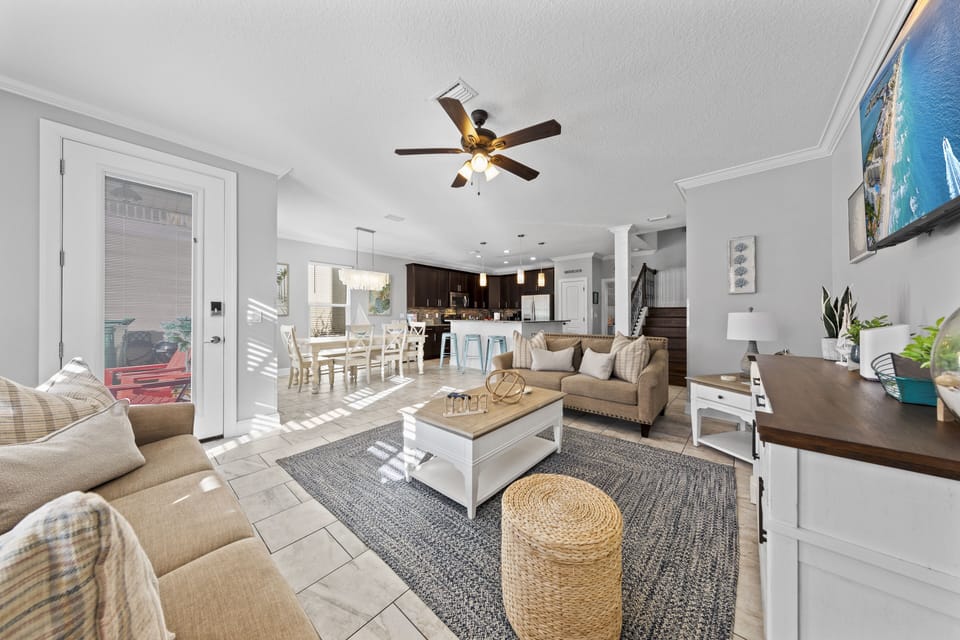 Open concept living room with 65 inch smart ROKU TV. Spacious, clean and comfy!