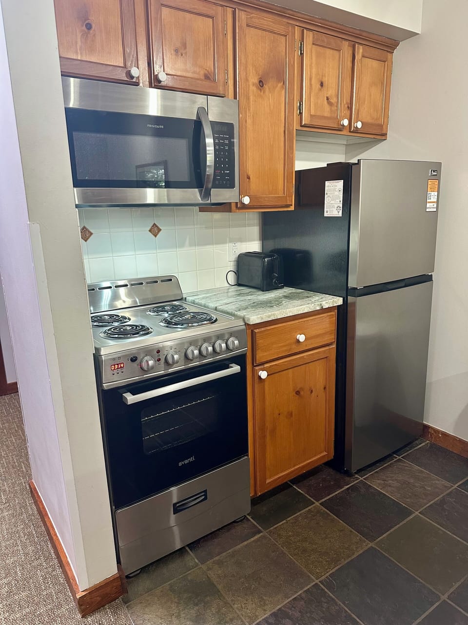 Kitchen with stainless steel appliances.