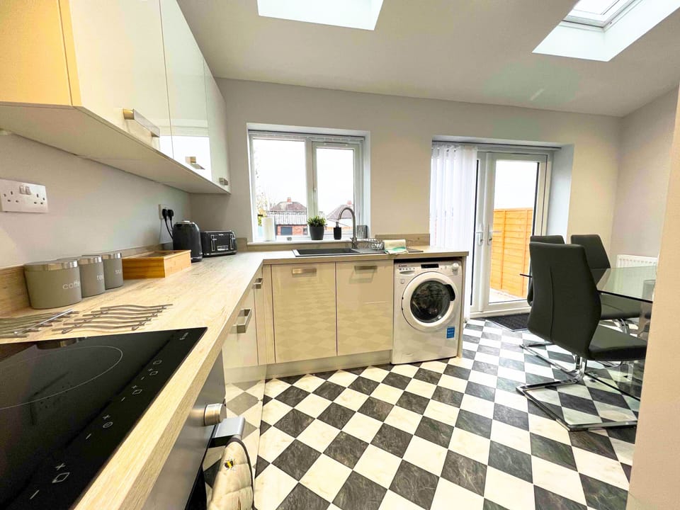 We have created an modern, open plan kitchen / dining / living room to socialise