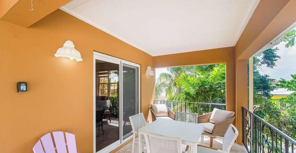 Private porch with outdoor dining table.