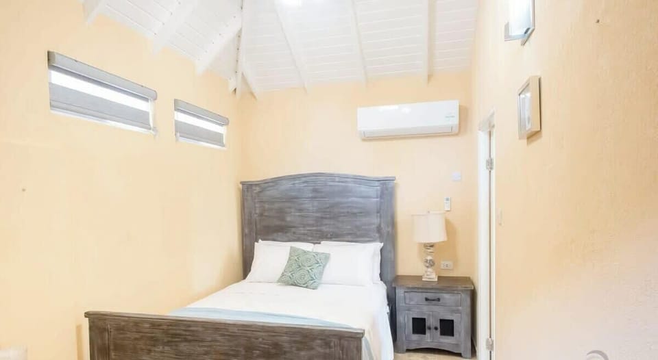 The bedroom has a queen bed & AC for comfort