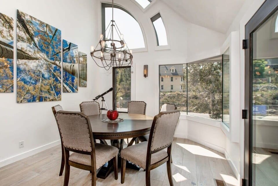 The dining area is located off of the living area with seating for six and beautiful mountain views.