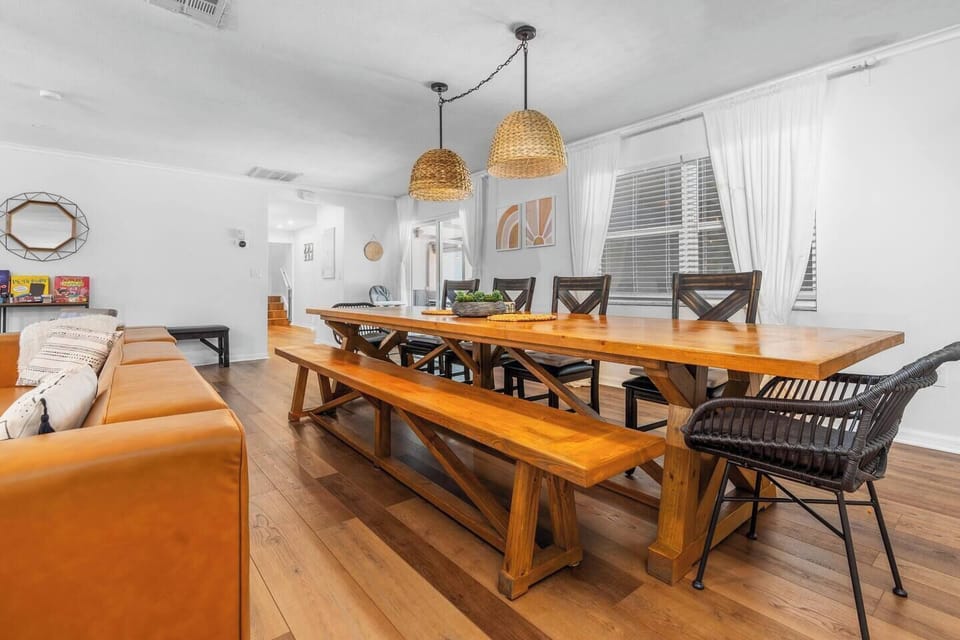 Newly decorated! Huge boho themed living room with 12-foot long custom dining table.