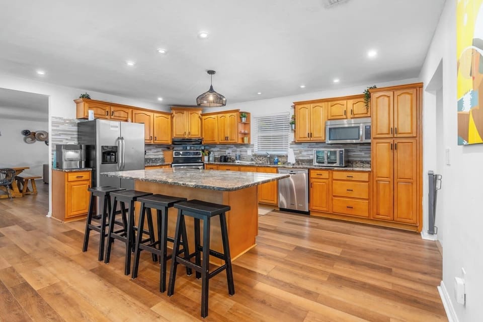 Gourmet Kitchen with Granite Counter Tops and Massive Island