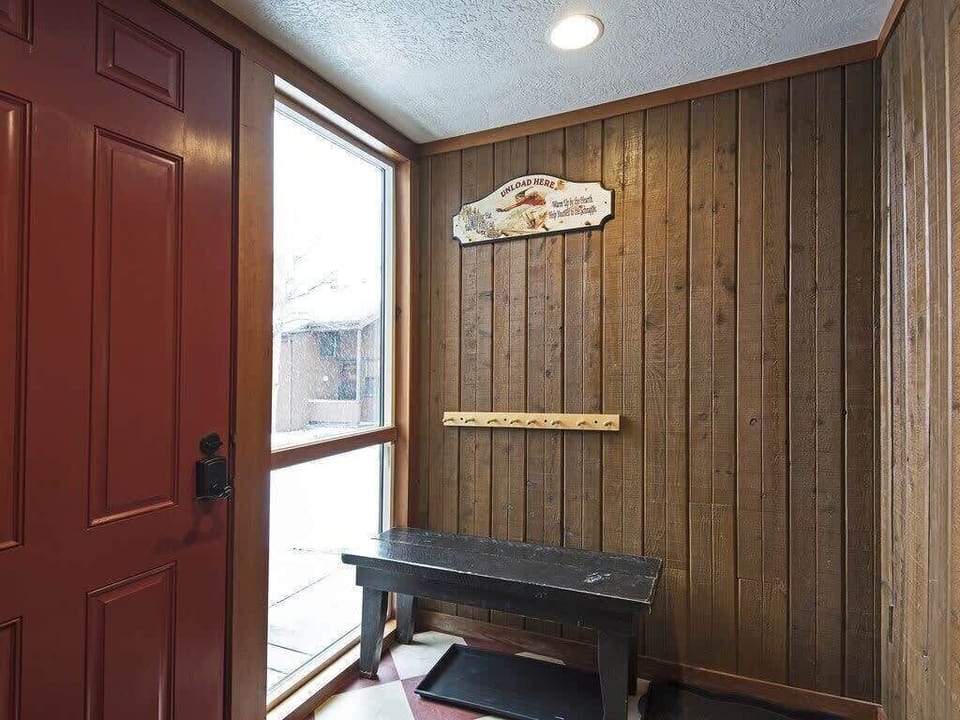 Upon entering the home, you will find a mudroom/laundry space with a bench, plenty of hooks for storing outdoor gear and a washer/dryer.